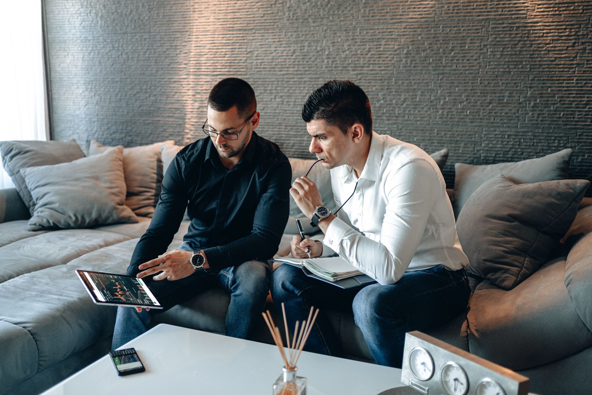 Consultants reviewing data together on a tablet